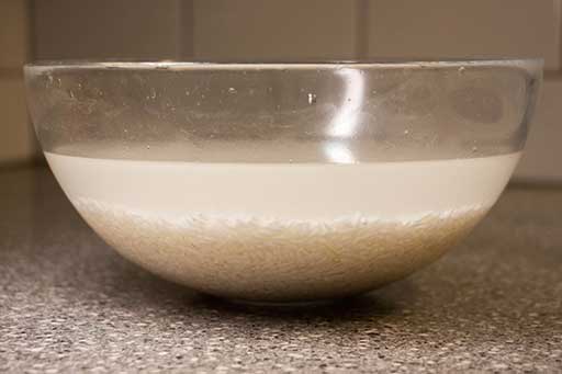 Rinse rice until water is become clear. Leave the rice covered with water for at least 30 minutes.