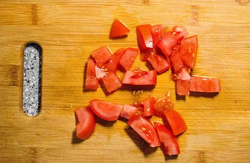 Chop tomatoes.