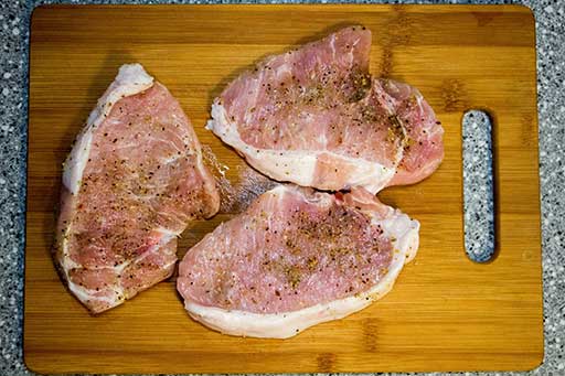 Place sliced pork in a single layer on a cutting board. Seasoning with salt and spices on both sides of slices.